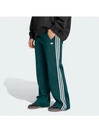 Spodnie sportowe damskie - adidas Spodnie dresowe Firebird KG3701 Zielony Loose Fit - miniaturka - grafika 1
