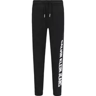 Spodnie i spodenki dla chłopców - CALVIN KLEIN JEANS Spodnie dresowe | Relaxed fit - miniaturka - grafika 1