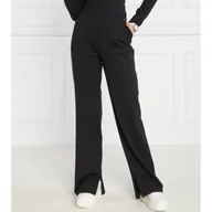 Dresy damskie - CALVIN KLEIN JEANS Spodnie dresowe MILANO | flare fit - miniaturka - grafika 1