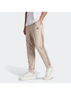 adidas Spodnie dresowe w kolorze beżowym - Spodnie sportowe męskie - miniaturka - grafika 1