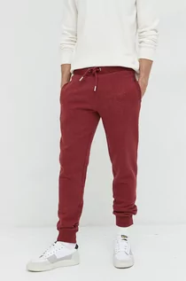 Spodnie męskie - Superdry spodnie dresowe męskie kolor bordowy melanżowe - grafika 1