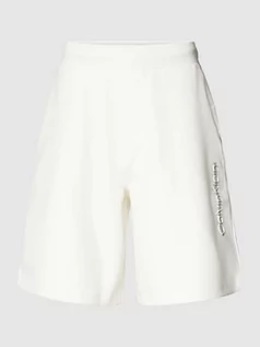 Spodnie sportowe męskie - Szorty z dzianiny dresowej o kroju regular fit w jednolitym kolorze - grafika 1