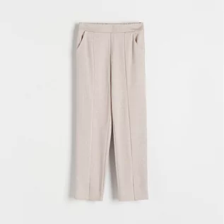 Spodnie i spodenki dla dziewczynek - Reserved - Spodnie z rozcięciami - Beżowy - grafika 1