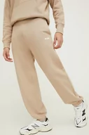 Spodnie męskie - MSGM spodnie dresowe bawełniane kolor beżowy gładkie - miniaturka - grafika 1