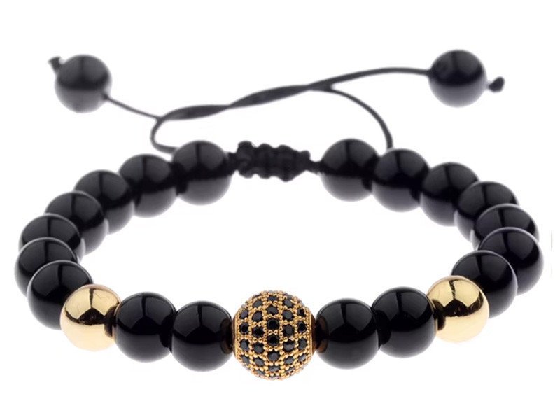 Bransoletka na czarnym sznurku z czarnymi i złotymi kuleczkami