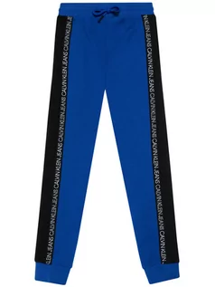 Spodnie i spodenki dla chłopców - Calvin Klein Jeans Spodnie dresowe Colour Block IB0IB00866 Niebieski Regular Fit - grafika 1