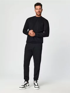 Spodnie męskie - Sinsay - Spodnie dresowe slim jogger - czarny - grafika 1