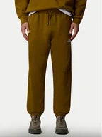 Spodnie sportowe męskie - The North Face Spodnie dresowe Essential NF0A8A6J Zielony Relaxed Fit - miniaturka - grafika 1