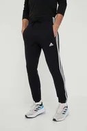 Spodnie męskie - adidas spodnie dresowe bawełniane kolor czarny z aplikacją - miniaturka - grafika 1
