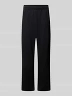 Spodnie sportowe męskie - Spodnie dresowe z prostą nogawką i wyhaftowanym logo - miniaturka - grafika 1