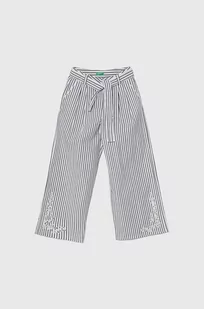 United Colors of Benetton spodnie dziecięce kolor biały wzorzyste - Spodnie i spodenki dla dziewczynek - miniaturka - grafika 1