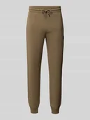 Spodnie sportowe męskie - Spodnie dresowe o kroju relaxed fit z naszywką z logo - miniaturka - grafika 1