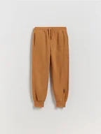 Spodnie i spodenki dla chłopców - Reserved - Dzianinowe joggery - brązowy - miniaturka - grafika 1