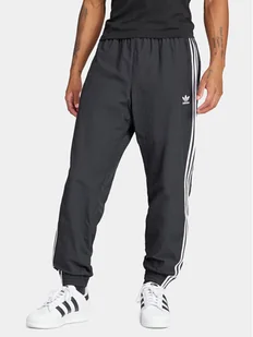 adidas Spodnie dresowe Adicolor Woven Firebird IT2501 Czarny Regular Fit - Spodnie sportowe męskie - miniaturka - grafika 1