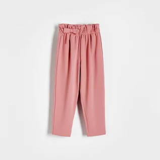 Spodnie i spodenki dla dziewczynek - Reserved - Dzianinowe spodnie z kokardką - Różowy - grafika 1
