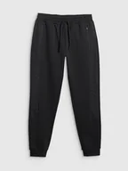 Spodnie sportowe męskie - 4F Spodnie dresowe w kolorze czarnym - miniaturka - grafika 1