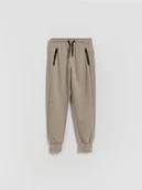 Spodnie i spodenki dla chłopców - Reserved - Bawełniane spodnie jogger - beżowy - miniaturka - grafika 1