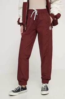 Spodnie damskie - Converse spodnie dresowe kolor bordowy gładkie - grafika 1