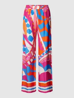 Spodnie damskie - Spodnie palazzo o luźnym kroju z wiskozy z graficznym wzorem - grafika 1