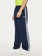 Spodnie sportowe męskie - adidas Spodnie dresowe adicolor Classics Firebird IM9471 Granatowy Regular Fit - miniaturka - grafika 1