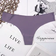 Majtki damskie - Różnokolorowe gładkie stringi - L Fioletowy - miniaturka - grafika 1