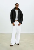 Kurtki damskie - Stradivarius Pikowana kurtka z kapturem Czarny S - miniaturka - grafika 1