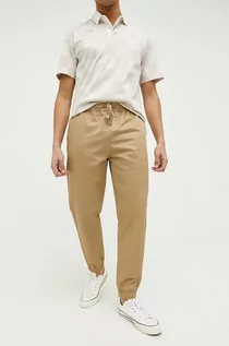 Spodnie męskie - Converse spodnie bawełniane kolor brązowy - grafika 1