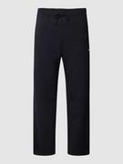 Spodnie sportowe męskie - Spodnie dresowe z nadrukiem z logo model ‘Hadim’ - miniaturka - grafika 1