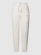 Spodnie sportowe damskie - Spodnie dresowe o kroju tapered fit z nadrukiem z logo - miniaturka - grafika 1