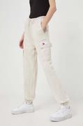 Spodnie damskie - Tommy Jeans spodnie dresowe kolor beżowy gładkie - miniaturka - grafika 1