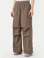 Spodnie sportowe damskie - adidas Spodnie dresowe Essentials Ripstop JD0783 Beżowy Loose Fit - miniaturka - grafika 1