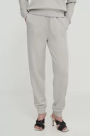 Spodnie damskie - Calvin Klein spodnie dresowe kolor beżowy gładkie - miniaturka - grafika 1