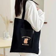 Torebki damskie - TEMU Torba Tote o Dużej Pojemności z Nadrukiem Kapibary "Nie Martw się, Bądź Szczęśliwy" - Damska Casualowa Czarna Poliestrowa Torba na Ramię z - miniaturka - grafika 1