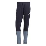 Dresy męskie - Spodnie dresowe męskie adidas ESSENTIALS MELANGE granatowe HK2898-M - miniaturka - grafika 1