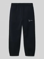 Spodnie i spodenki dla chłopców - Spodnie dresowe o kroju regular fit z wyhaftowanym logo - miniaturka - grafika 1