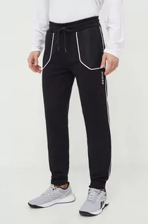 Spodnie męskie - Guess spodnie dresowe kolor czarny z aplikacją - grafika 1