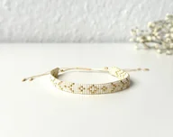 Bransoletki - Bransoletka złoto kremowa - miniaturka - grafika 1