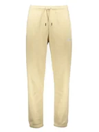 Spodnie sportowe męskie - The North Face Spodnie dresowe "Essentials" w kolorze kremowym - miniaturka - grafika 1