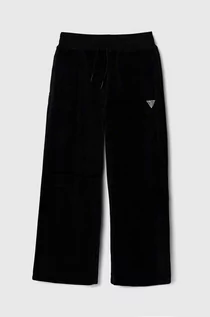 Spodnie i spodenki dla dziewczynek - Guess spodnie dresowe welurowe dziecięce kolor czarny gładkie - grafika 1