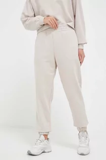 Spodnie damskie - 4F spodnie dresowe kolor beżowy gładkie - grafika 1