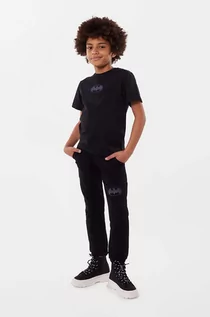 Spodnie i spodenki dla dziewczynek - Dkny spodnie dresowe bawełniane dziecięce kolor czarny z nadrukiem - DKNY - grafika 1