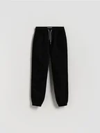 Spodnie i spodenki dla chłopców - Reserved - Bawełniane spodnie jogger - czarny - miniaturka - grafika 1