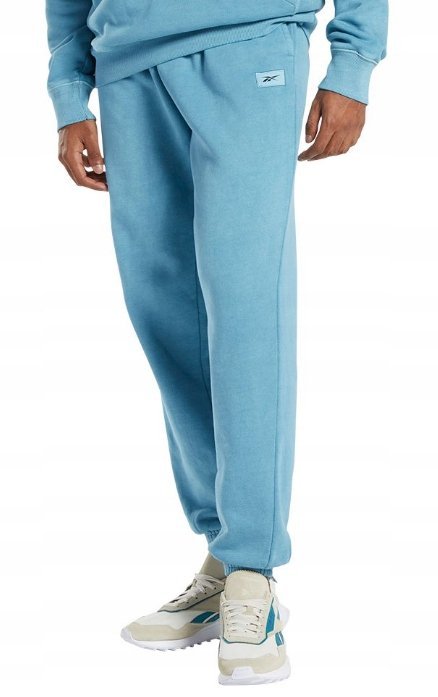 REEBOK SPODNIE DRESOWE MĘSKIE NIEBISKIE Z LOGO M 0A7B5_B* TŁA