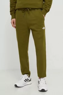Spodnie męskie - The North Face spodnie dresowe bawełniane kolor zielony z nadrukiem NF0A87DEPIB1 - grafika 1