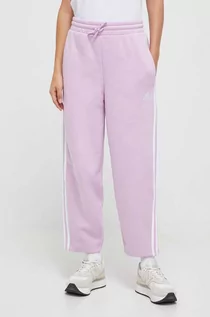 Spodnie damskie - adidas spodnie dresowe kolor różowy z aplikacją - grafika 1