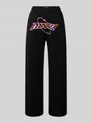 Spodnie sportowe damskie - Spodnie dresowe o luźnym kroju z nadrukiem z logo — REVIEW X MATW - miniaturka - grafika 1
