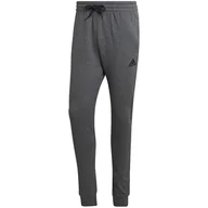 Spodnie sportowe męskie - Spodnie męskie adidas Essentials Fleece Regular Tapered - miniaturka - grafika 1