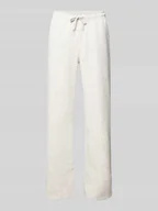 Spodnie sportowe damskie - Spodnie dresowe o kroju straight fit z tunelem - miniaturka - grafika 1