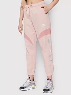 Spodnie sportowe damskie - Nike Spodnie dresowe Air DD5419 Różowy Relaxed Fit - grafika 1