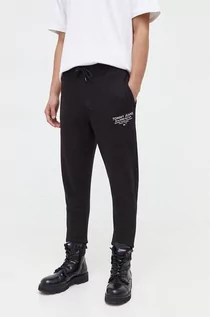 Spodnie męskie - Tommy Jeans spodnie dresowe bawełniane kolor czarny z nadrukiem - grafika 1